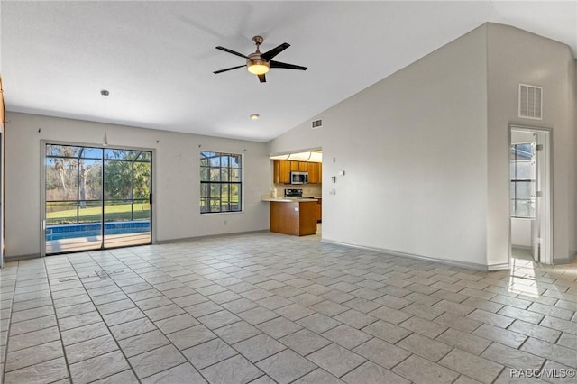 unfurnished living room featuring ceiling fan, high vaulted ceiling, and light tile patterned floors