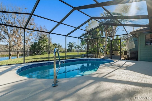 view of pool with a lanai and a patio