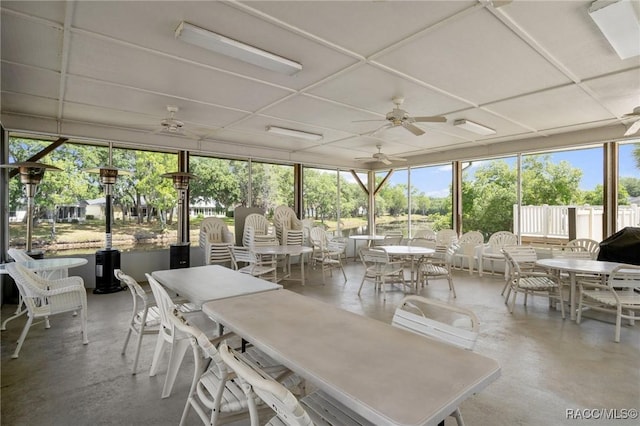 sunroom / solarium with ceiling fan and a wealth of natural light