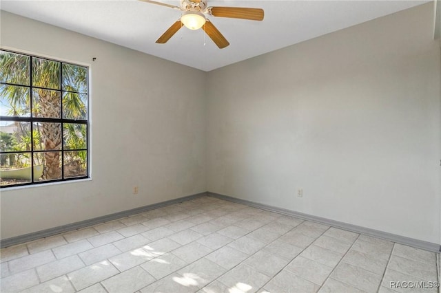 unfurnished room with ceiling fan and a wealth of natural light