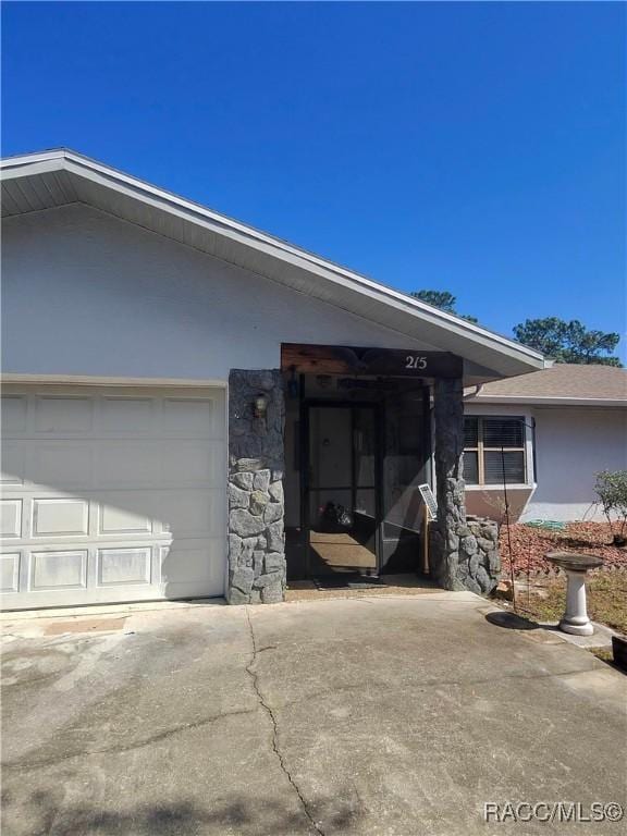 exterior space featuring concrete driveway