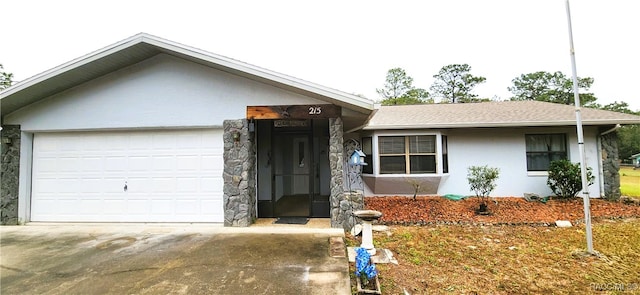 single story home featuring a garage, driveway, a shingled roof, and stucco siding