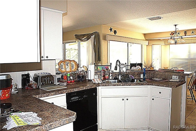 kitchen featuring black dishwasher, sink, kitchen peninsula, and white cabinets