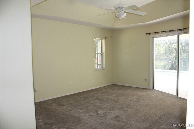 clothes washing area with cabinets, separate washer and dryer, and dark tile patterned flooring