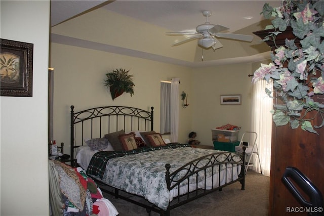 bedroom featuring ceiling fan and carpet floors