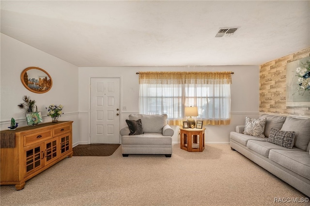 living room with carpet and visible vents