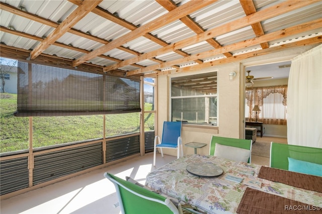 sunroom featuring ceiling fan and visible vents