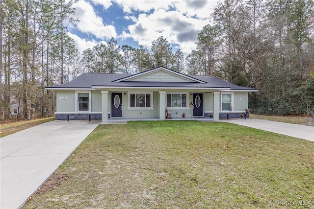 9459 N Camel Dr, Citrus Springs, FL 34434 - view of front facade featuring covered porch, concrete driveway, a front yard, stucco siding, and roof with shingles