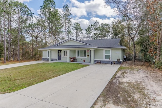 9459 N Camel Dr, Citrus Springs, FL 34434 - single story home featuring concrete driveway, covered porch, a front yard, roof with shingles, and stucco siding