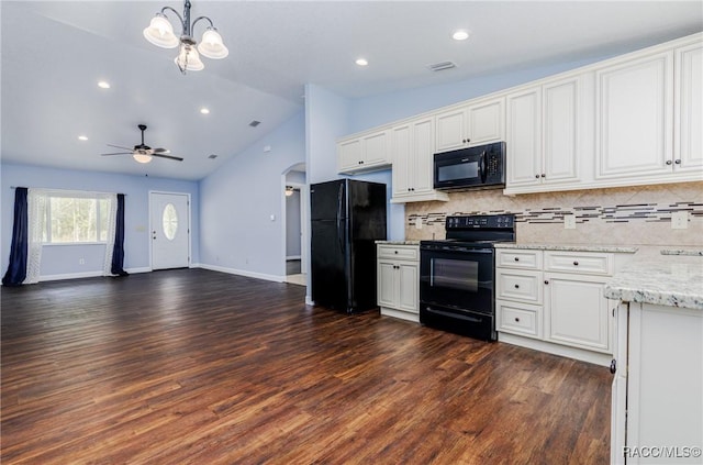 9459 N Camel Dr, Citrus Springs, FL 34434 - kitchen featuring black appliances, arched walkways, vaulted ceiling, backsplash, and white cabinetry