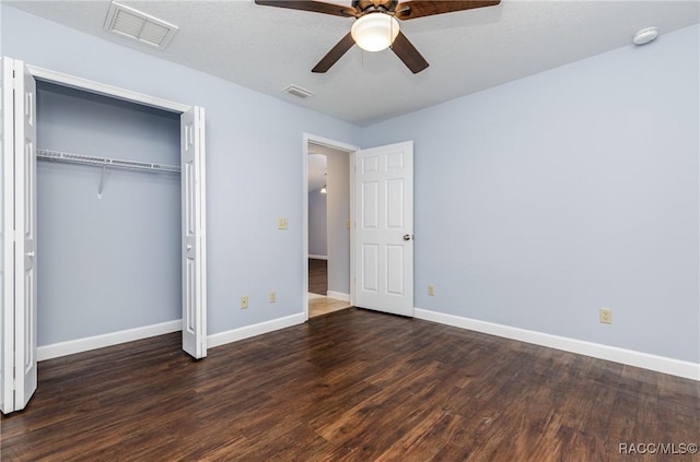 9459 N Camel Dr, Citrus Springs, FL 34434 - unfurnished bedroom featuring wood finished floors, a closet, and a ceiling fan