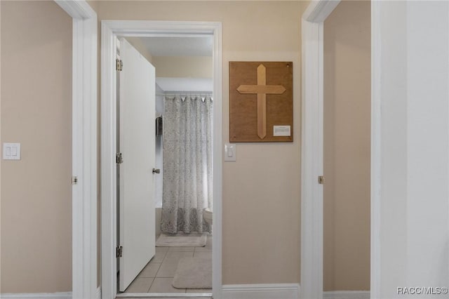 corridor with light tile patterned floors