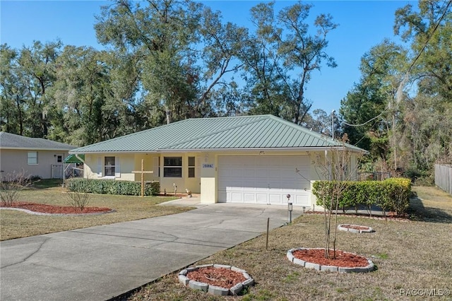 ranch-style house featuring a garage and a front yard