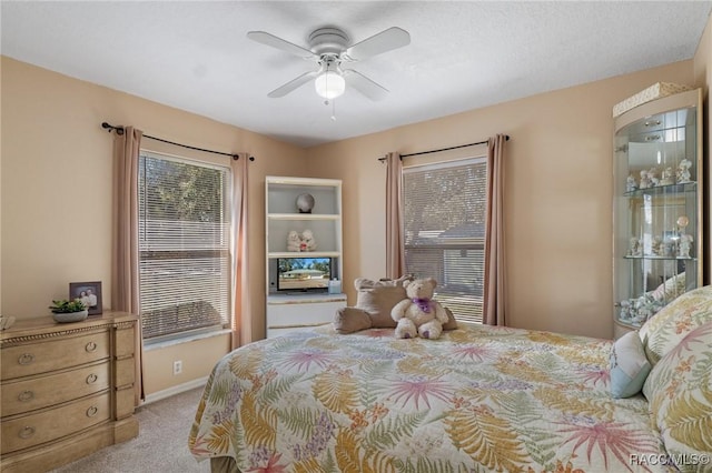 bedroom with light carpet and ceiling fan