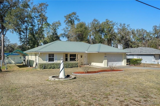 ranch-style home featuring a garage and a front lawn