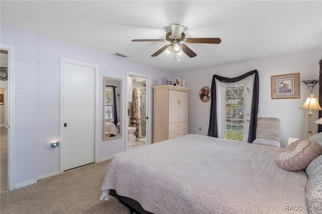 carpeted bedroom with ceiling fan and ensuite bathroom