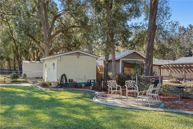 view of yard with a patio and an outdoor structure