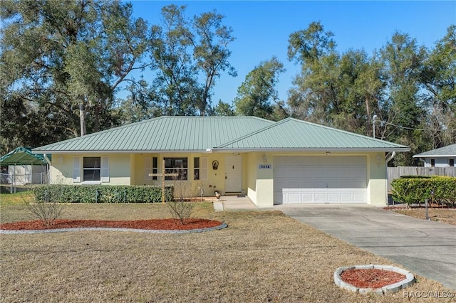 ranch-style house with a garage and a front lawn