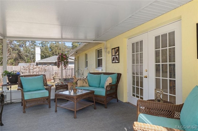 sunroom / solarium featuring french doors