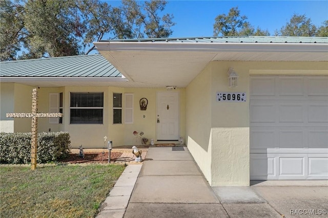 property entrance with a garage