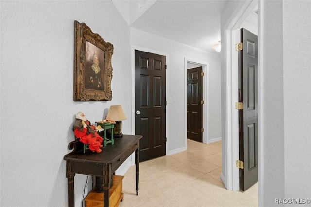 hall featuring light tile patterned floors