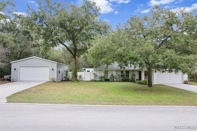 ranch-style home with a front yard and a garage