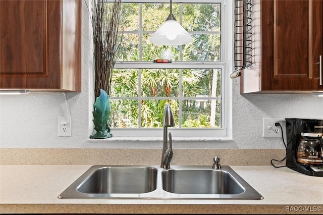 kitchen featuring sink and a healthy amount of sunlight