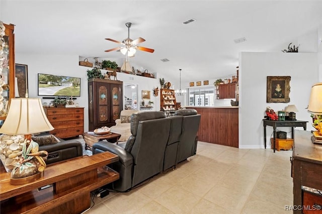 living room with ceiling fan and lofted ceiling