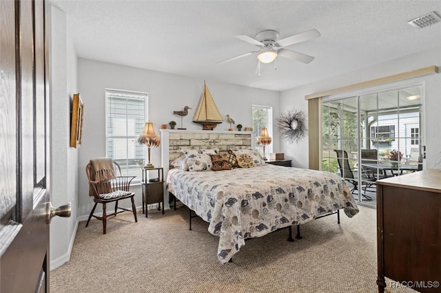 bedroom with light colored carpet and ceiling fan