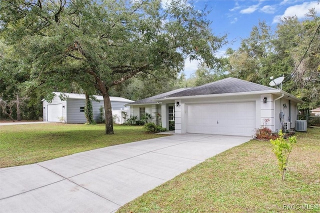 ranch-style house featuring a front yard, a garage, and cooling unit