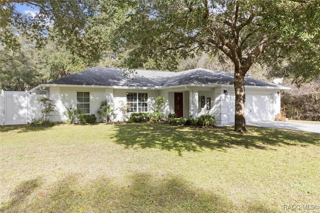 ranch-style home featuring a front yard and a garage