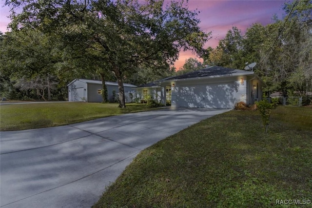 ranch-style home featuring a yard