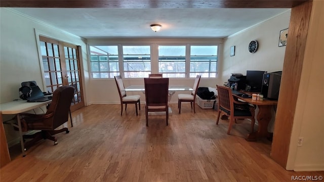 office with hardwood / wood-style floors and ornamental molding