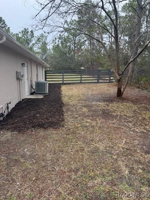 view of yard with central AC