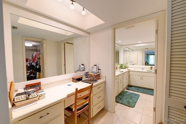 bathroom featuring tile patterned flooring and vanity