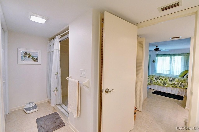 corridor featuring light tile patterned floors