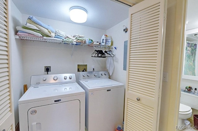 laundry area with washing machine and clothes dryer