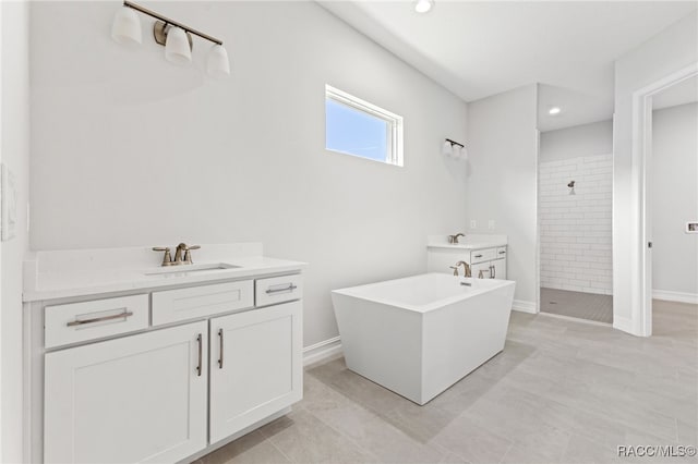 bathroom with vanity, tile patterned floors, and independent shower and bath