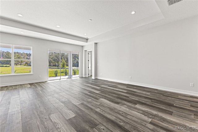 unfurnished room with dark wood-type flooring