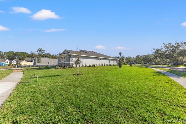 view of home's exterior featuring a lawn