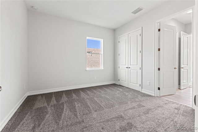 unfurnished bedroom with carpet floors