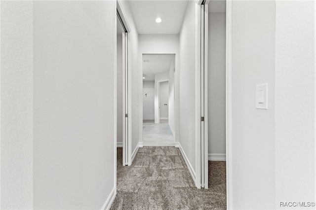 corridor with light colored carpet