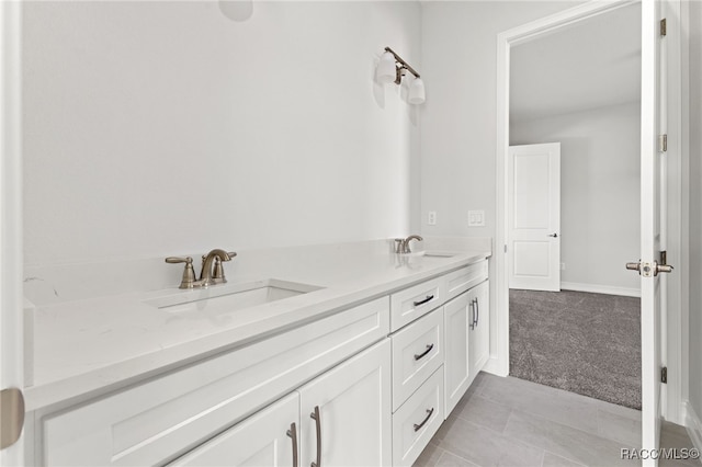 bathroom featuring tile patterned flooring and vanity