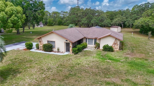 262 N Indianapolis Ave, Hernando, FL 34442 - ranch-style house featuring stucco siding and a front lawn