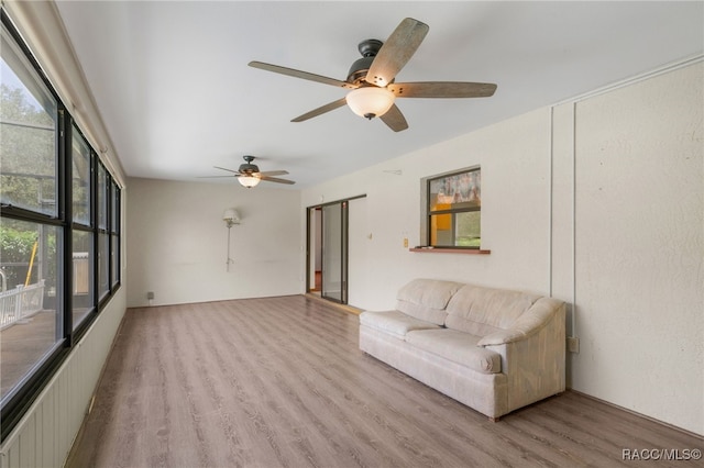 262 N Indianapolis Ave, Hernando, FL 34442 - living area featuring healthy amount of natural light, wood finished floors, and a ceiling fan