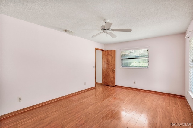 262 N Indianapolis Ave, Hernando, FL 34442 - spare room featuring light wood-style floors, ceiling fan, baseboards, and a textured ceiling