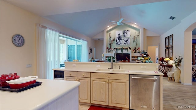 4690 W Tomahawk Dr, Beverly Hills, FL 34465 - kitchen with stainless steel dishwasher, light brown cabinets, a sink, ceiling fan, and arched walkways
