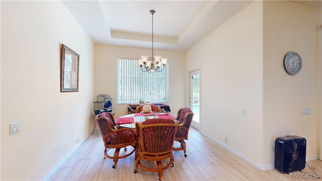 4690 W Tomahawk Dr, Beverly Hills, FL 34465 - dining area featuring a chandelier, baseboards, a tray ceiling, and light wood finished floors