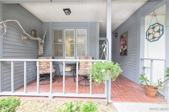 doorway to property with a porch