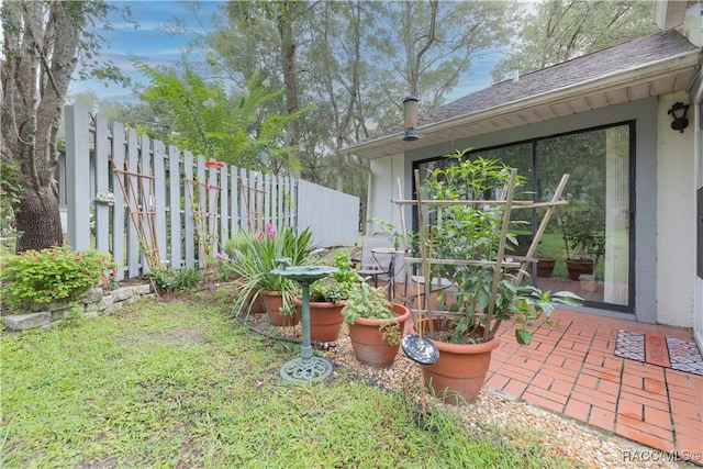 view of yard featuring a patio area and fence